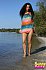 Sunny Pussy - Skinny brunette hair undressing on the beach and playing in the warm water.